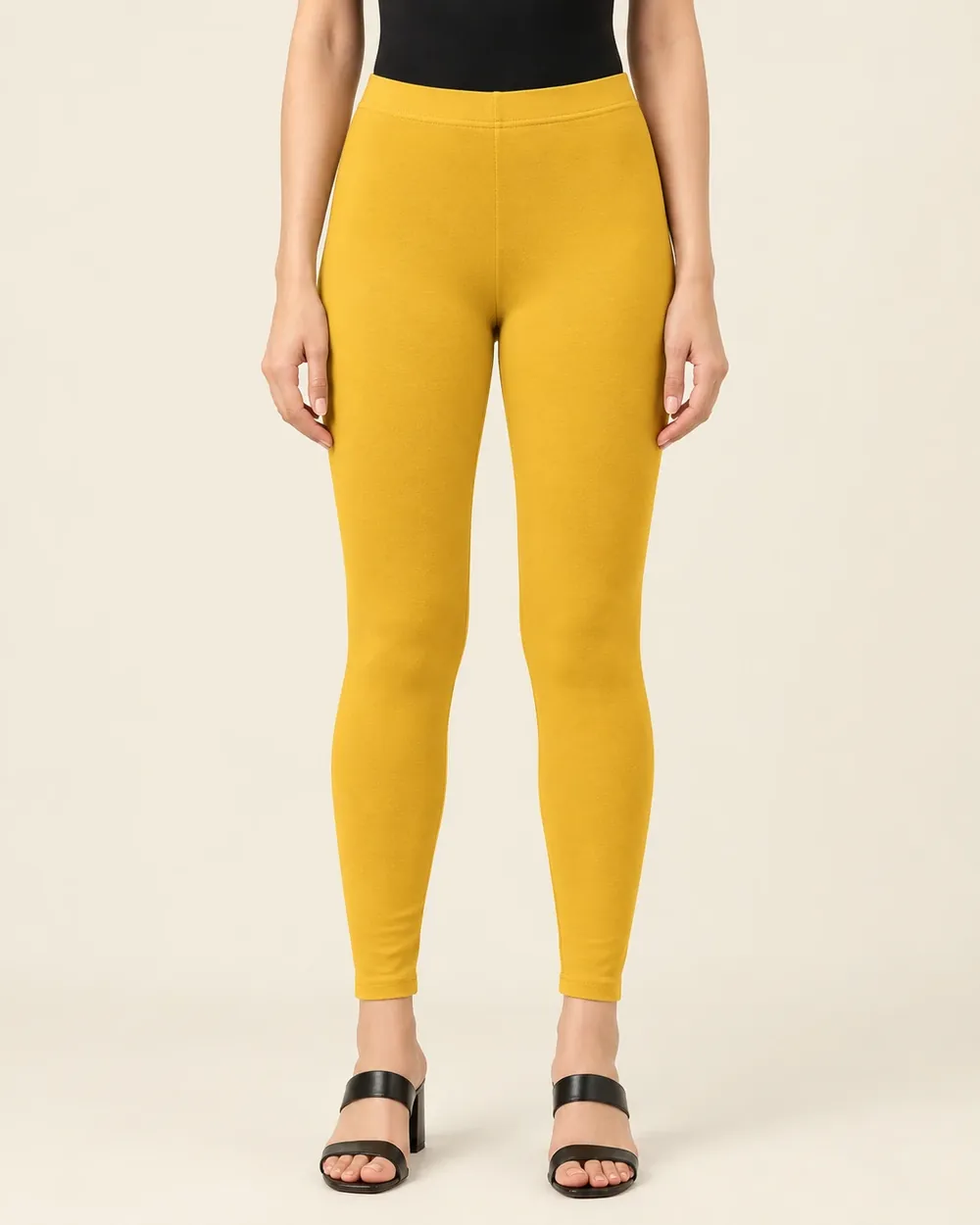 Sreeva mustard yellow ankle length cotton leggings, deep golden yellow, front view